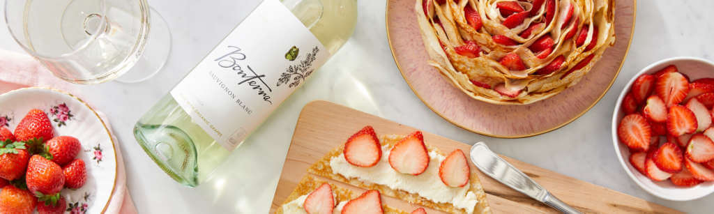 Strawberry Crepe Cake with Sauv Blanc bottle of wine